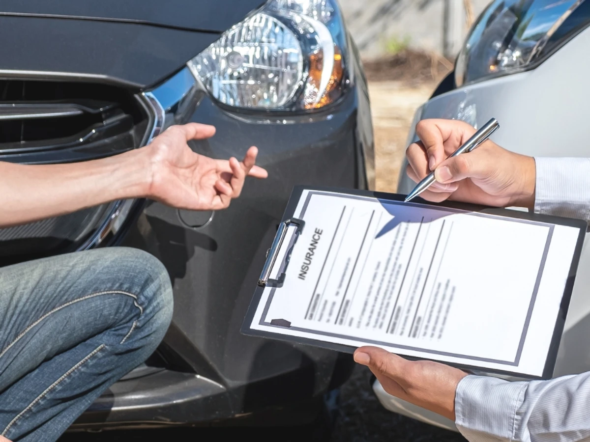 Reviewing an auto glass insurance claim after storm damage